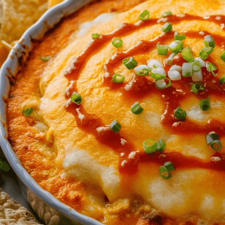 Turn up the heat with this crowd-pleasing Buffalo Chicken Dip! Loaded with shredded chicken, creamy cheeses, and spicy buffalo sauce, this dip is perfect for game days, parties, or any time you’re craving bold, zesty flavors. Serve it warm with chips, crackers, or veggie sticks for a guaranteed hit. 🌶️🐔🧀 Why You’ll Love This Dip Bold Flavors: Spicy buffalo sauce pairs perfectly with creamy cheeses and tender chicken. Quick & Easy: Ready in under 30 minutes with simple ingredients. Versatile: Perfect with chips, crackers, bread, or veggie sticks. Make Ahead: Easy to prep and bake when ready to serve. What Makes This Dip Special? Buffalo Chicken Dip takes all the flavors of your favorite wings and transforms them into a creamy, cheesy dip that’s perfect for sharing. It’s the ultimate appetizer for those who love heat and tangy goodness. Health Benefits: Chicken: A lean source of protein. Buffalo Sauce: Adds bold flavor without the need for excessive seasoning. Cheese: Provides calcium and richness. Fun Additions & Variations Extra Heat: Add a pinch of cayenne or drizzle with extra hot sauce. Ranch Lovers: Mix in a packet of ranch seasoning for added flavor. Blue Cheese Kick: Add crumbled blue cheese for a classic buffalo twist.