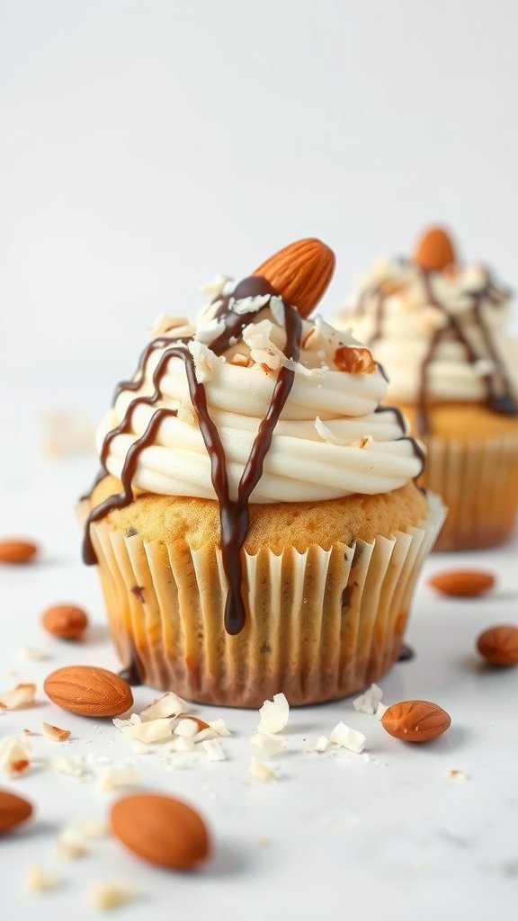 Two Almond Joy cupcakes with icing, drizzled chocolate, and almonds on top, surrounded by almond pieces and coconut flakes.