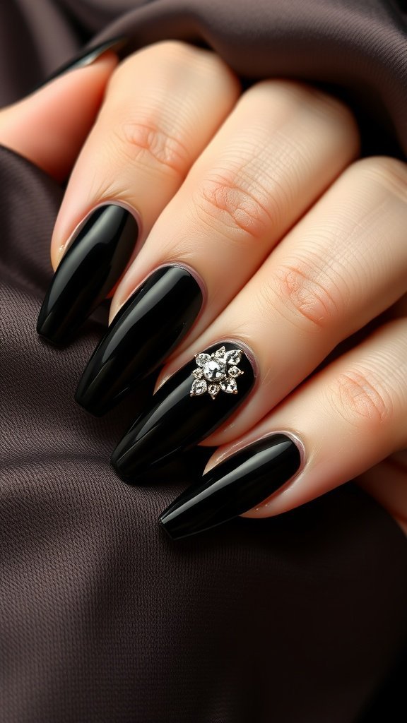 Velvet black nails adorned with rhinestones, creating a glamorous look.