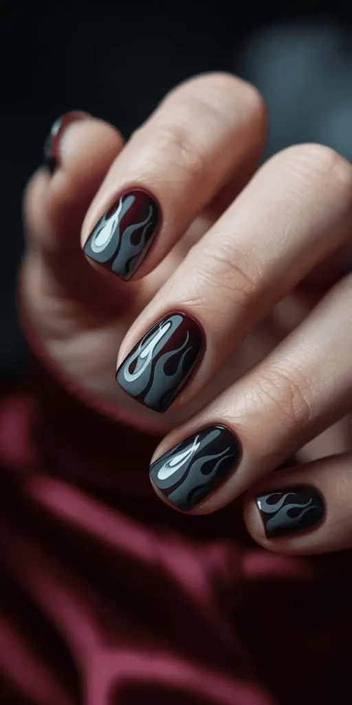 Ombre bases with rising black flames are edgy and cool. Choose neon underneath for contrast or go dark-on-dark for a subtle burn.