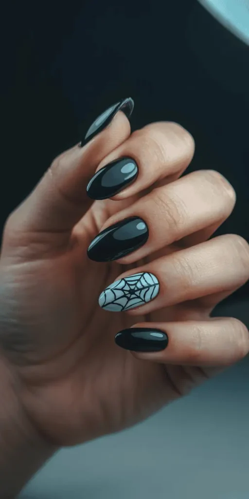 Elegant yet eerie, spiderwebs on your nails create instant gothic charm. Try a sheer base with fine black web lines and a tiny silver glitter accent for a spooky-chic look.