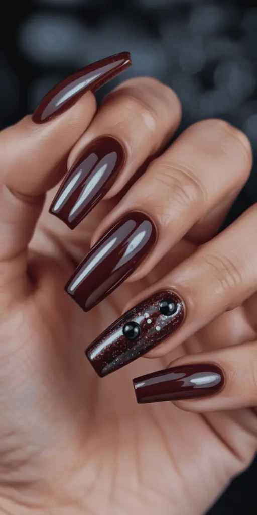 Lean into Halloween with literal coffin-shaped nails painted deep burgundy, matte black, or glossy dark chrome. Add spider charms or studs for bonus edge.