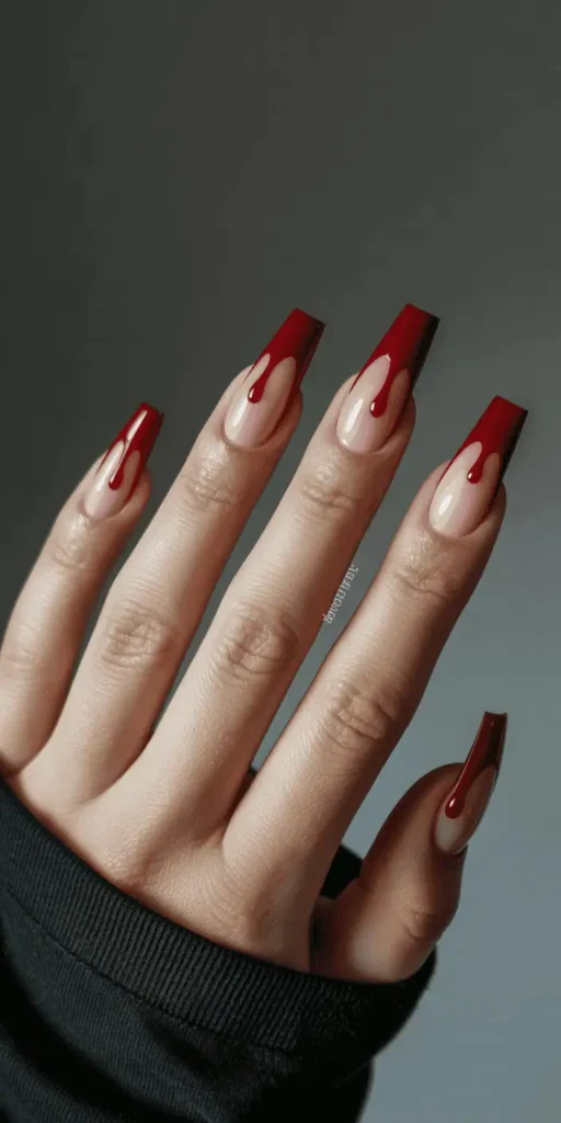 Go full-on glam-gore with a nude or pale base and deep red polish dripping from the cuticles. It's creepy, bold, and surprisingly easy to recreate.