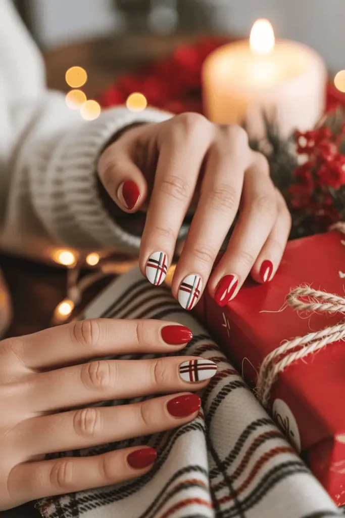 Red and white plaid accent nails, hands near cozy flannel or a wrapped gift.